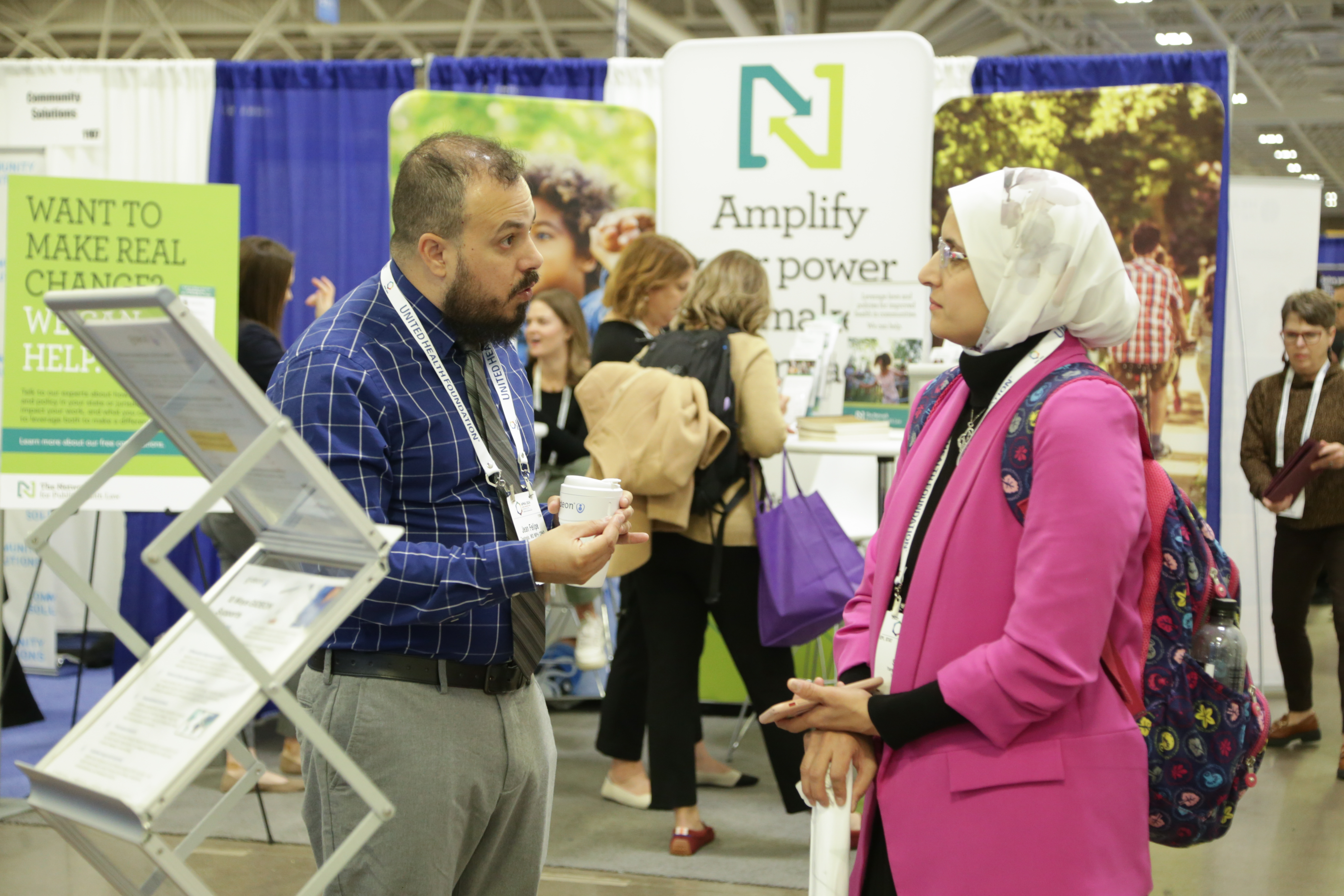 Photo of two people t an Exhibit Booth