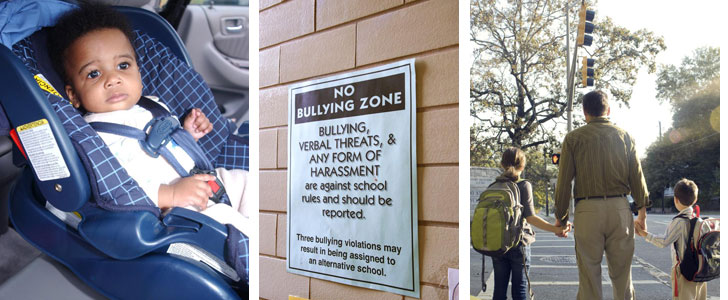 baby in car seat anti bullying sign and dad holding kids hands in crosswalk