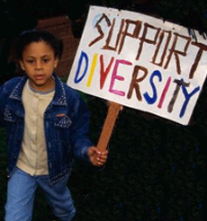 boy holds protest sign